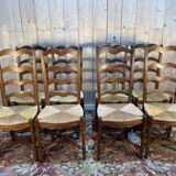Set of 8 rustic high-back straw chairs.