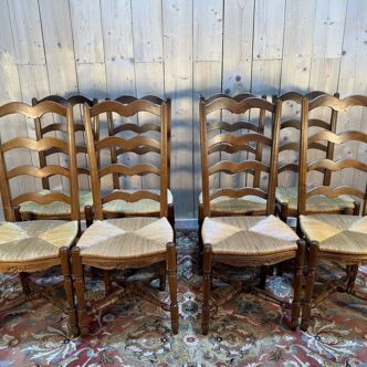 Set of 8 rustic high-back straw chairs.