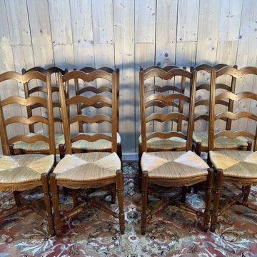 Set of 8 rustic high-back straw chairs.