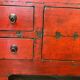 Antique Chinese red lacquered low cabinet