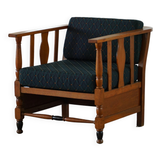 Art Nouveau, pair of oak lounge chairs, reupholstered in style fabric, 1920s.
