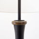 Tripod floor lamp in wrought iron and brass with bamboo-style base.