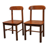 pair of solid pine chairs by Rainer Daumiller