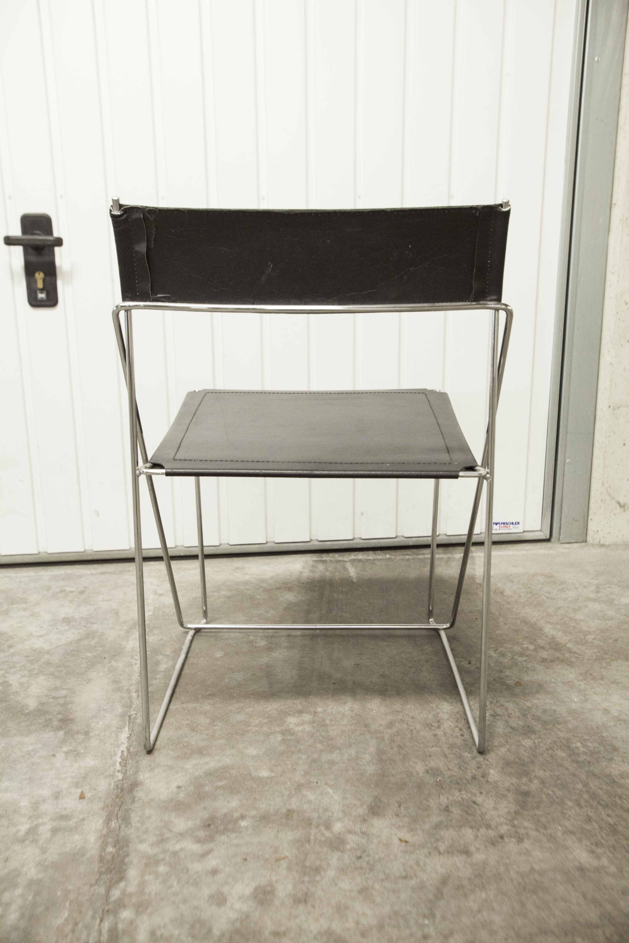 Set of 3 minimalist X line chairs by Niels Jorgen Haugesen.