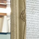 Beveled mirror in carved wood