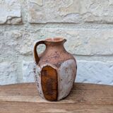 Old small pitcher in glazed terracotta