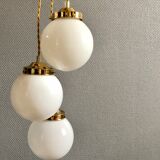Three-light cascade suspension, vintage globes in white opaline