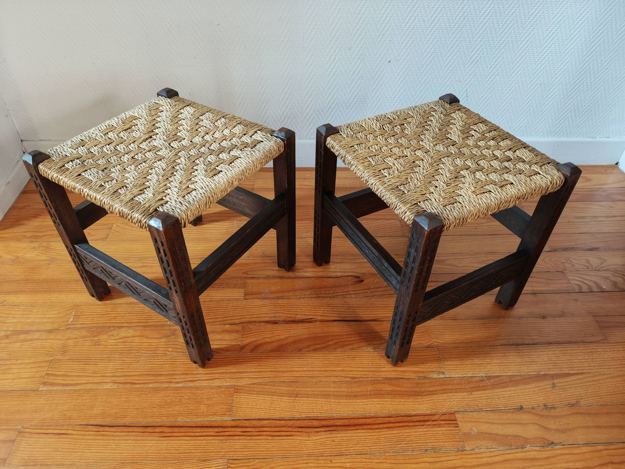 Pair of handcrafted stools from Friuli in carved wood, Italy, circa 1960.