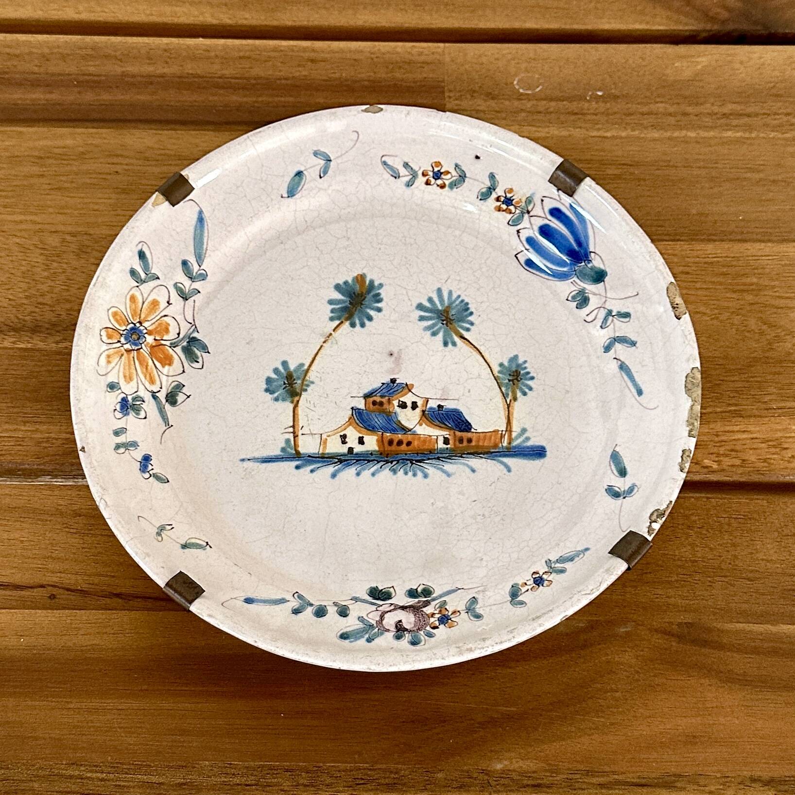 Earthenware plate with polychrome decoration - 18th century