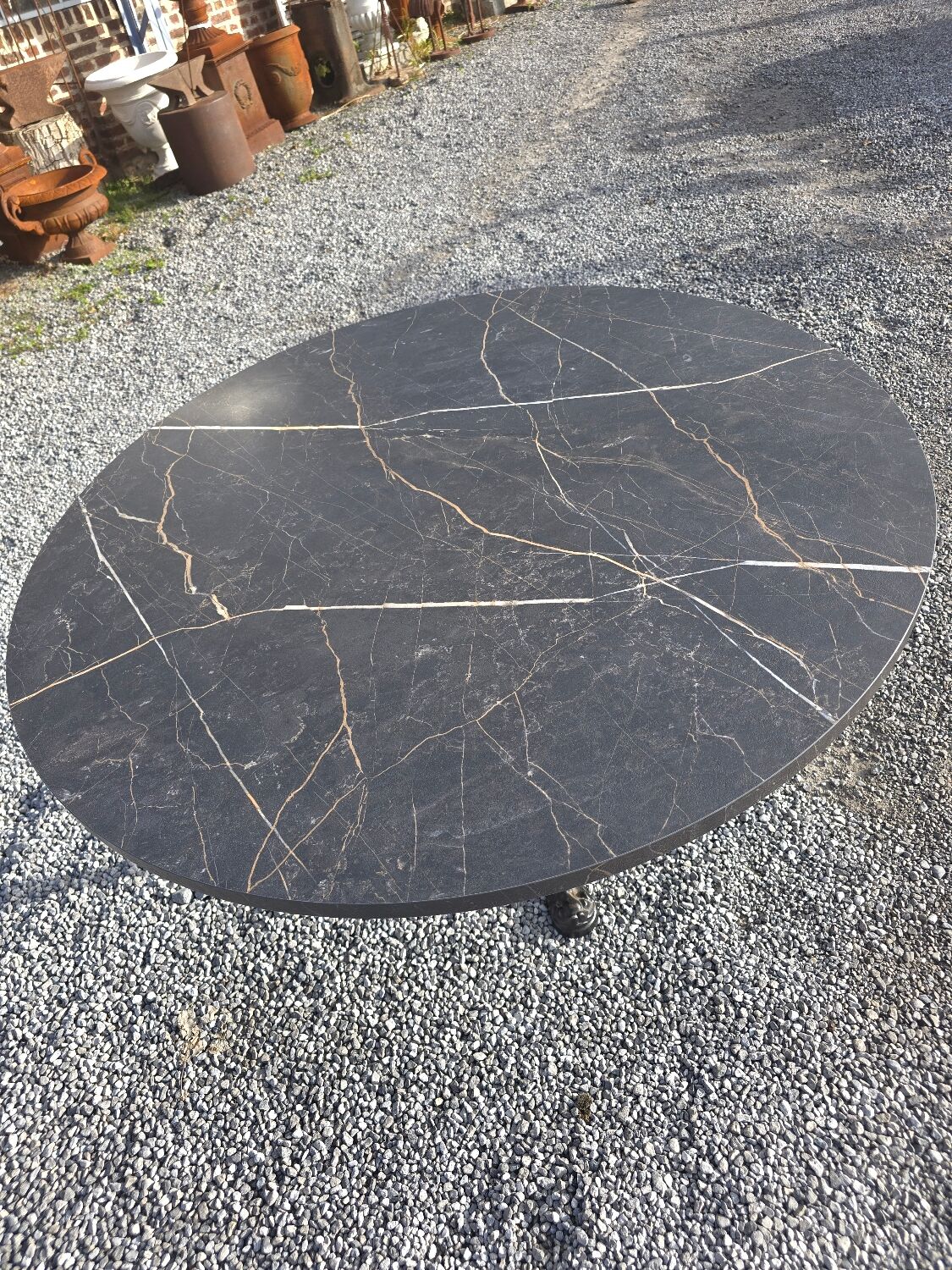 Bistro pedestal table with cast iron base and marble effect top