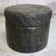 Pouf in black/green leather