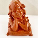 Bust of a pensive child in plaster