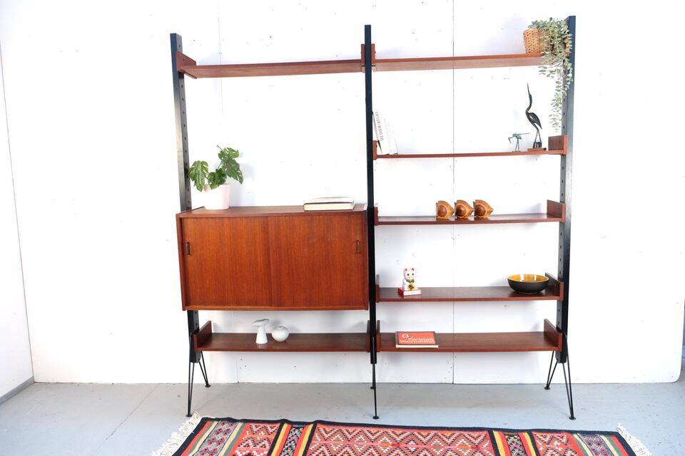 Vintage teak shelving system in 60s-70s style, retro style.