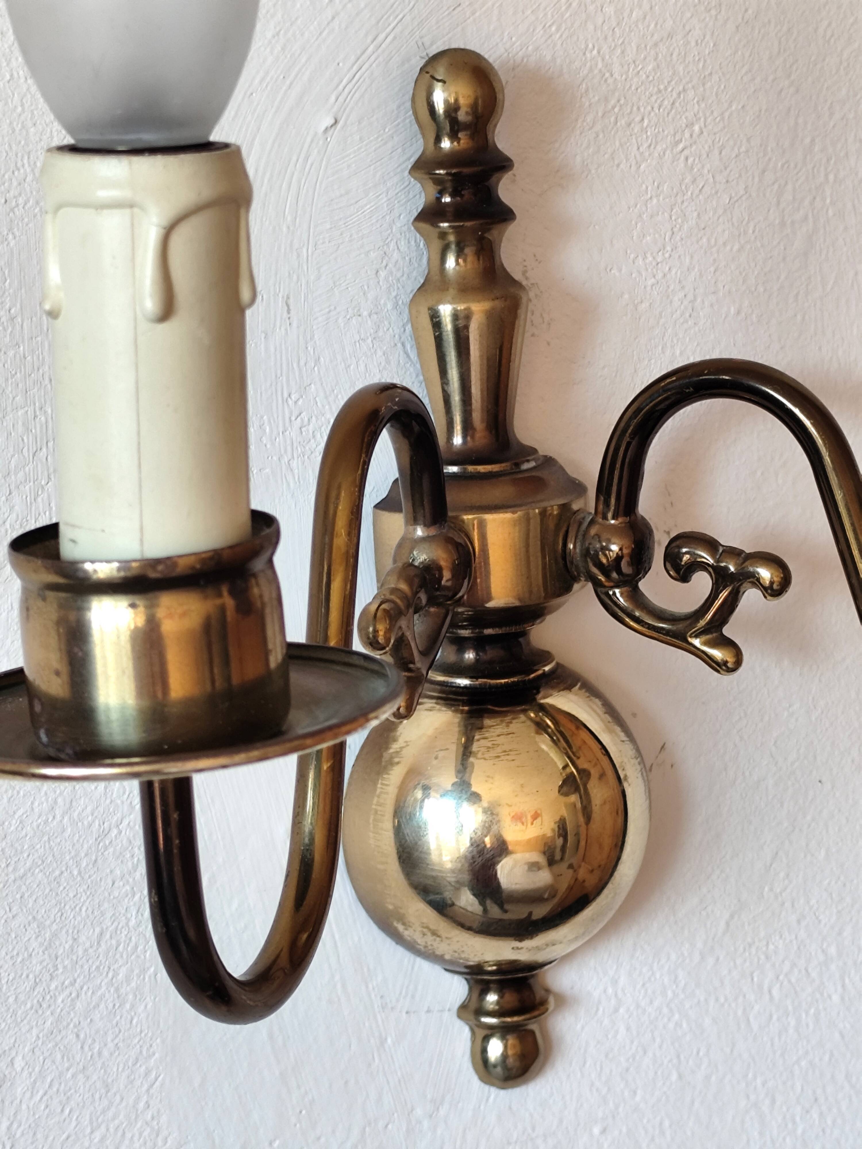 Pair of Dutch style 2-light brass wall lights