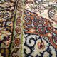 Handmade Persian carpet in wool and silk.