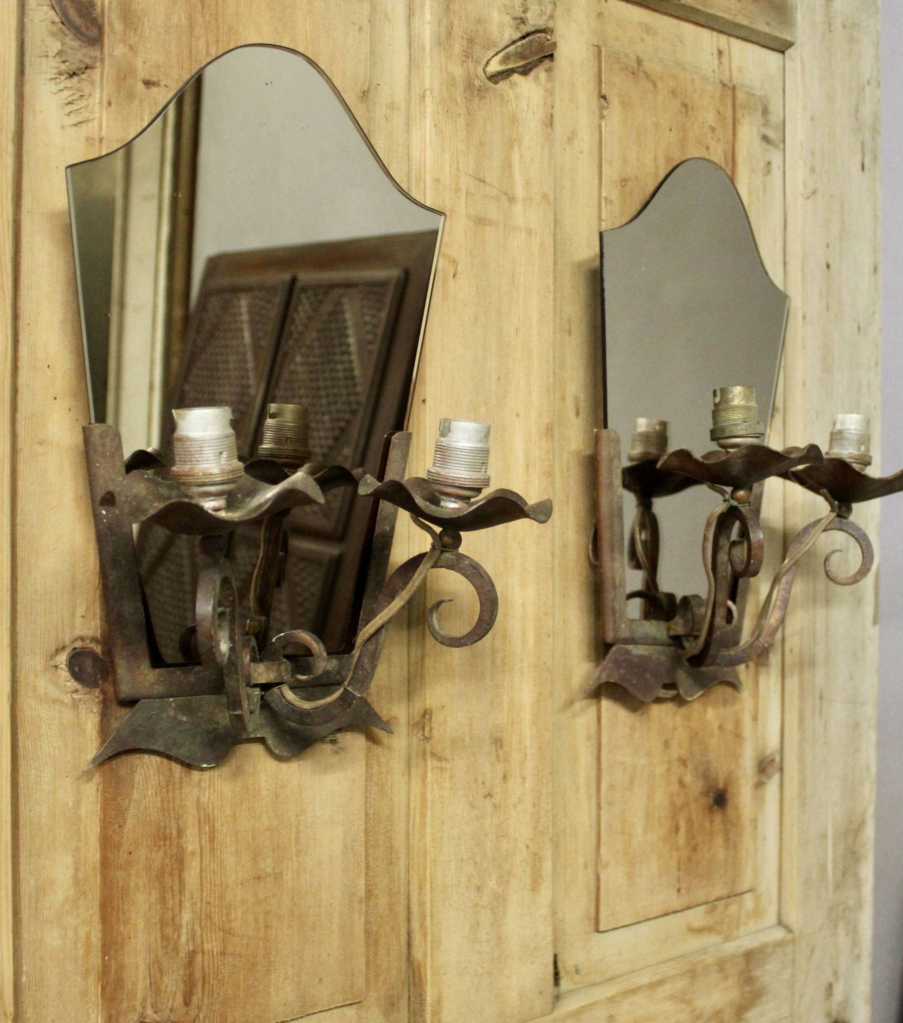 Pair of Art Deco wrought iron and smoked glass wall lights