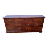 Old and authentic trade storage unit counter with 12 large drawers in cherry wood 1950