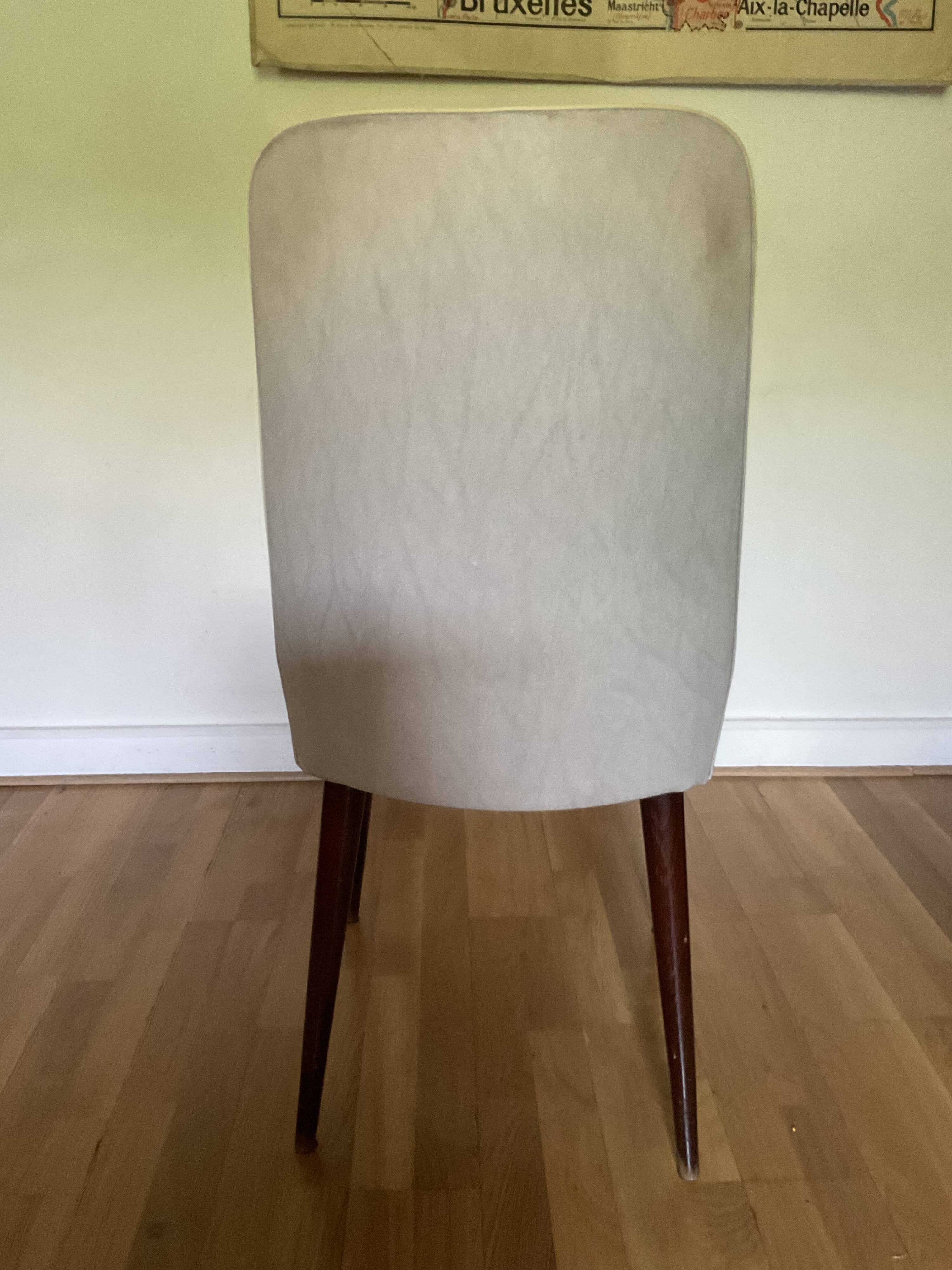 Pair of vintage mahogany and skai chairs