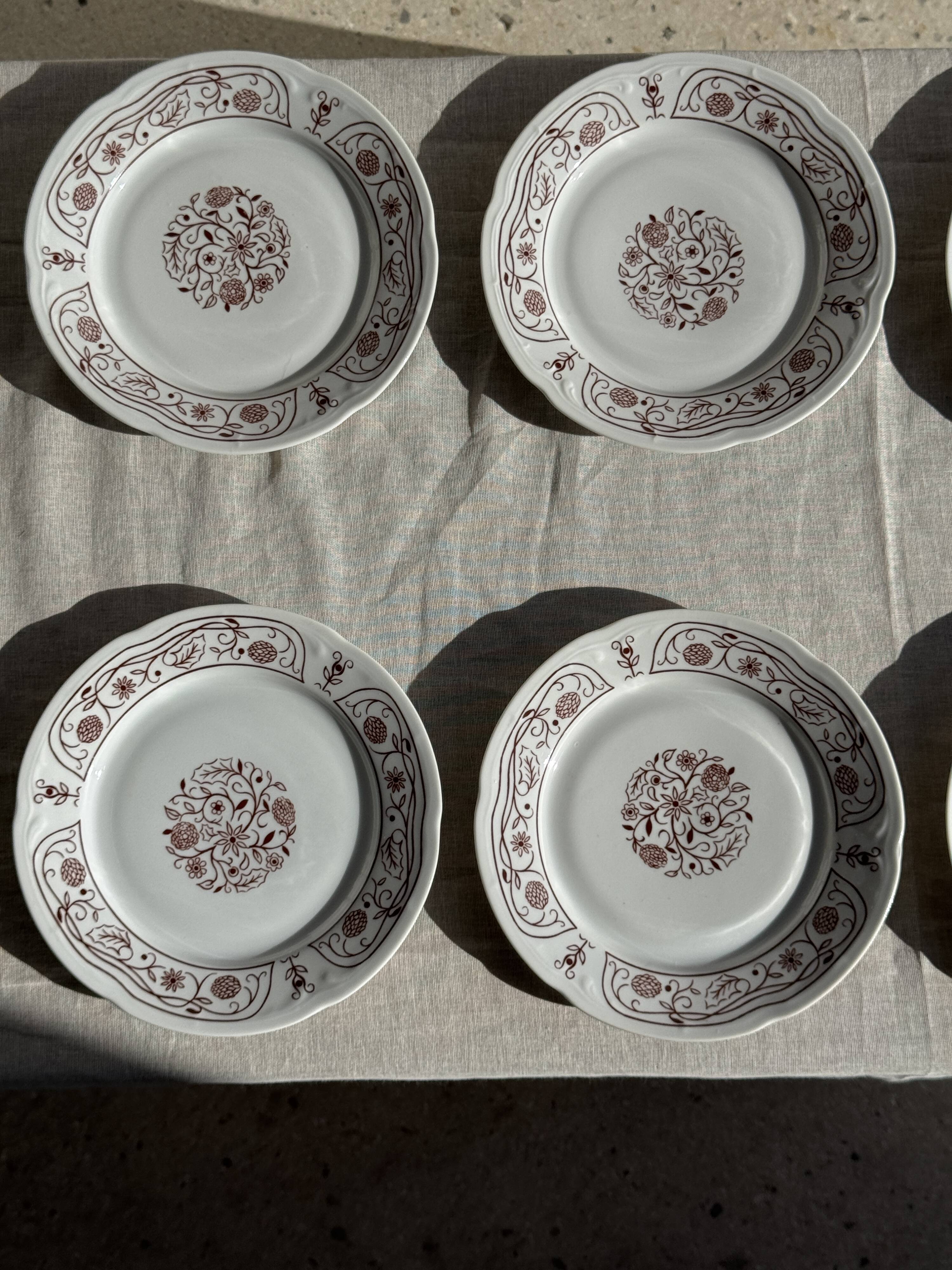 Set of 6 vintage dessert plates made in Poland with a plant motif.