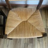 Pair of low wooden and straw armchairs