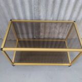 Gold metal coffee table and smoked glass