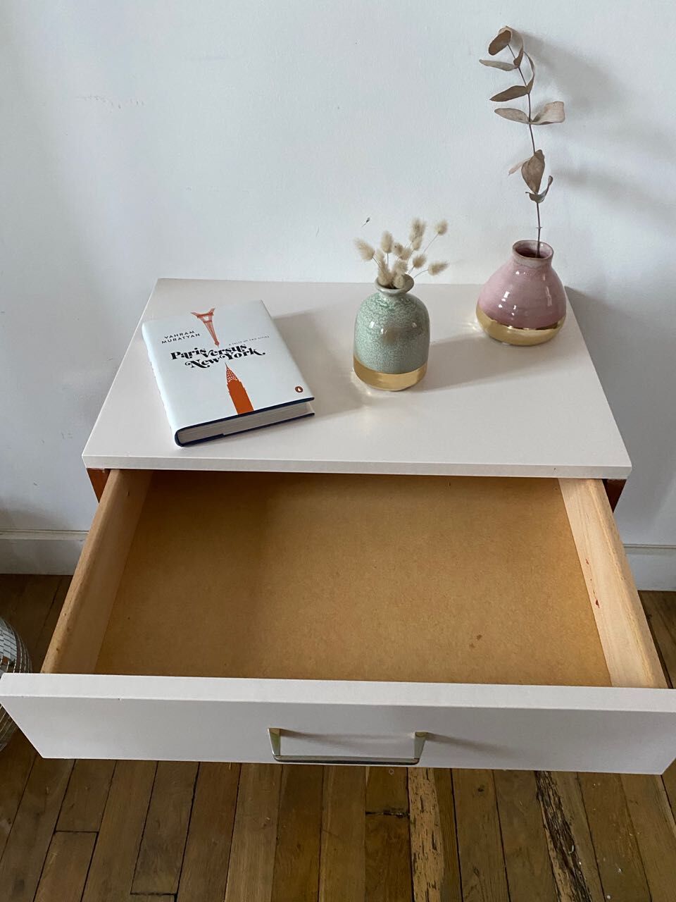 Wooden bedside table and nude