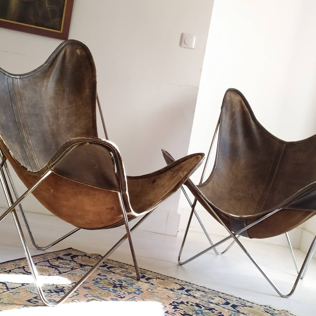 AA Butterfly leather armchairs