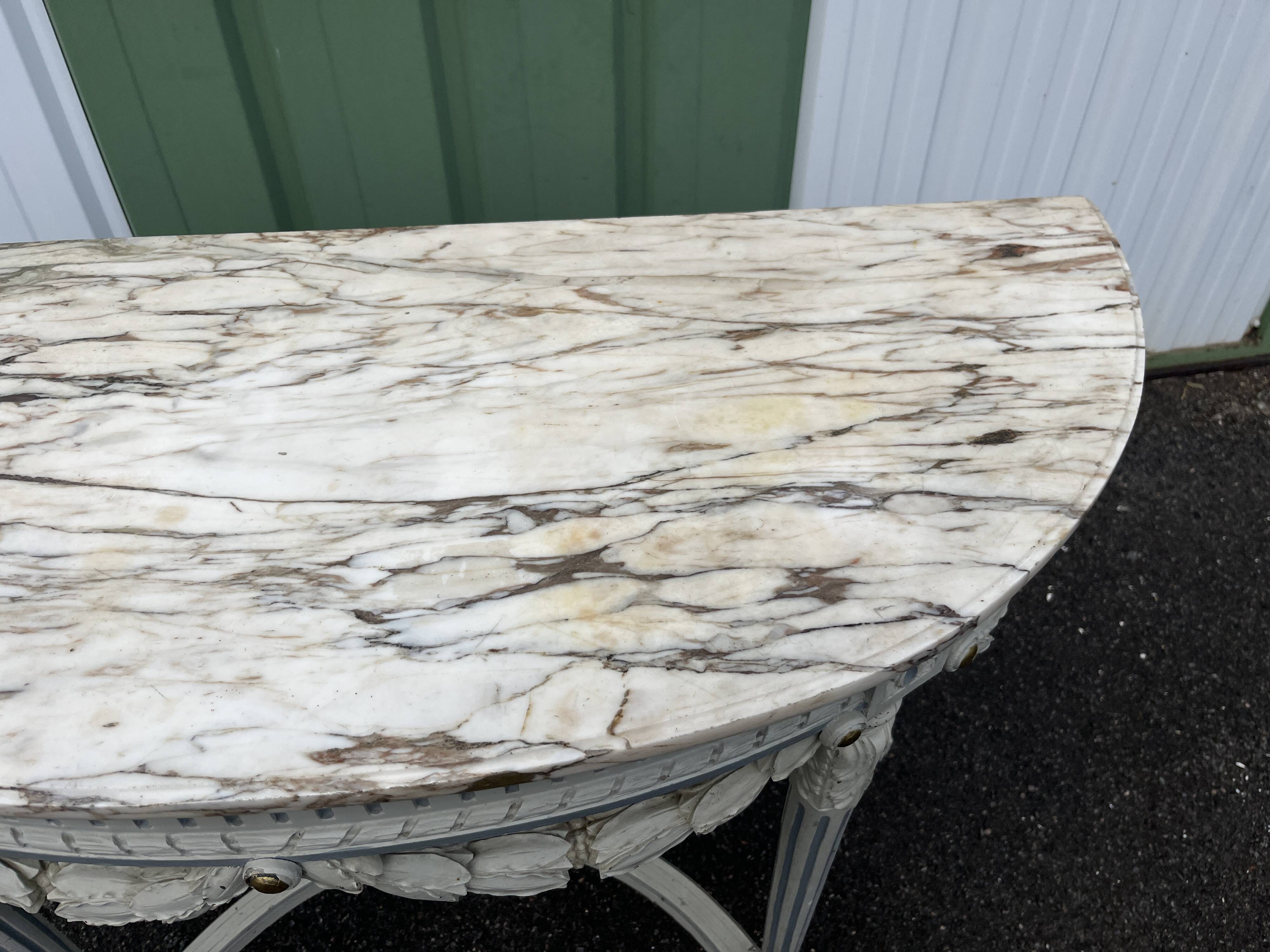 Louis XVI style half-moon console table with carved and painted wood and marble top
