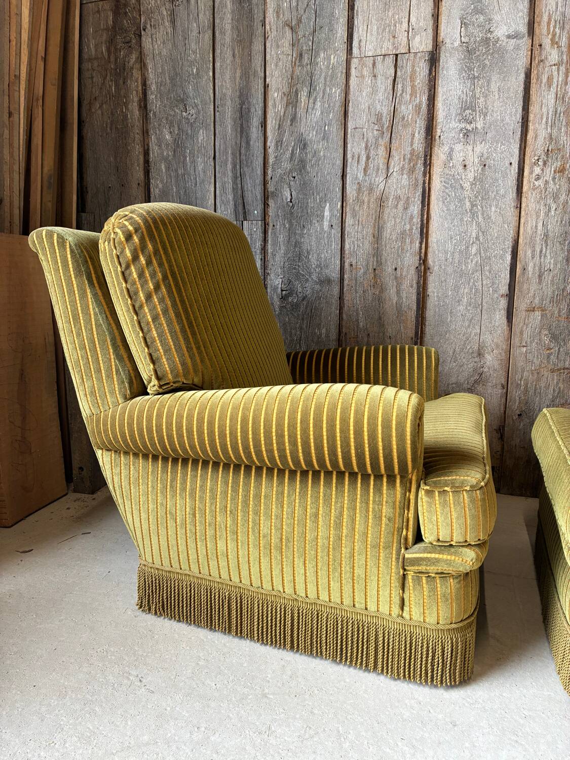 Pair of green recliner chairs