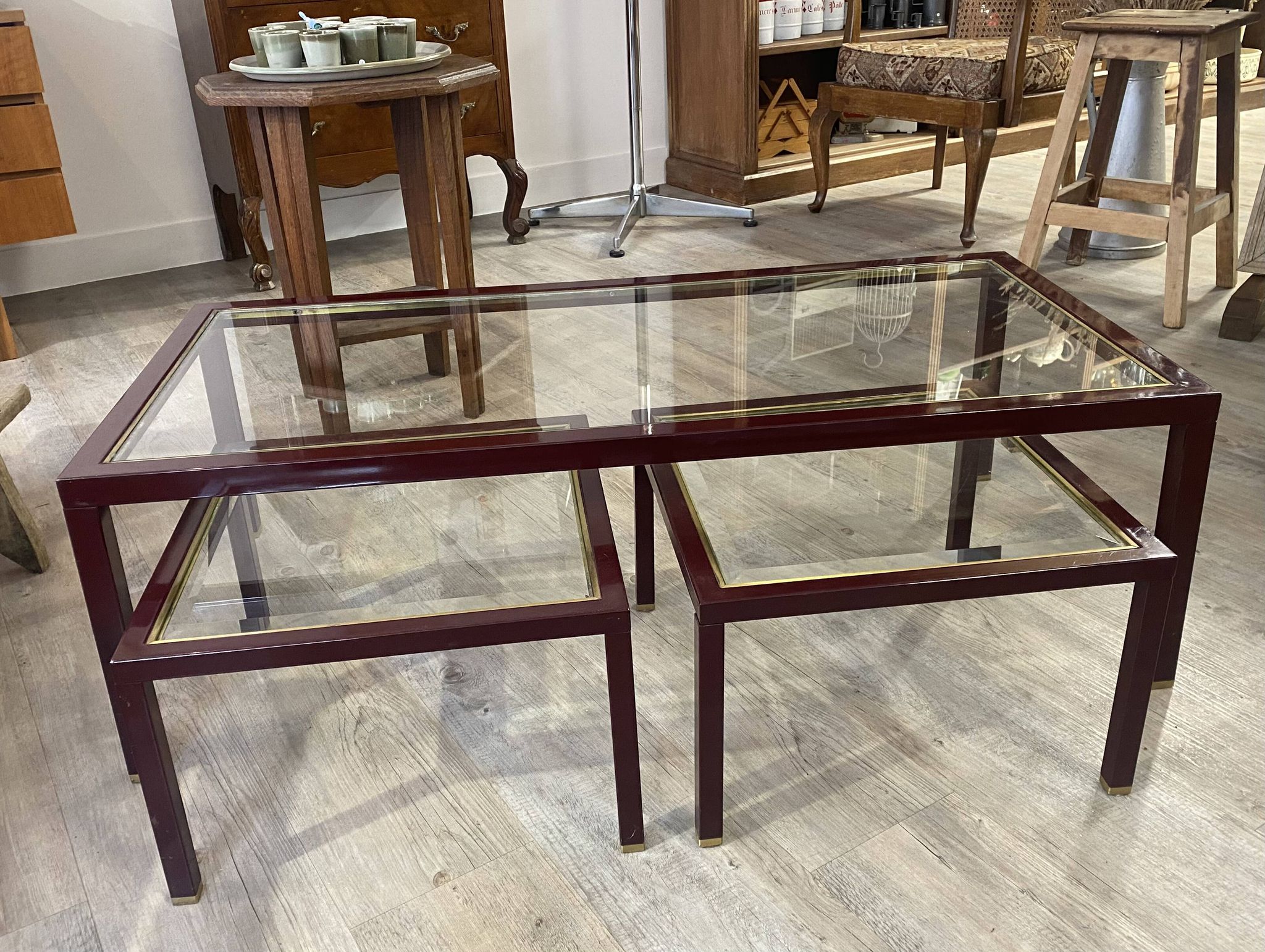 Burgundy lacquered metal, brass and beveled glass nesting tables, France 1950s