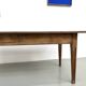 Solid pine farmhouse table, two drawers, fluted legs, France.