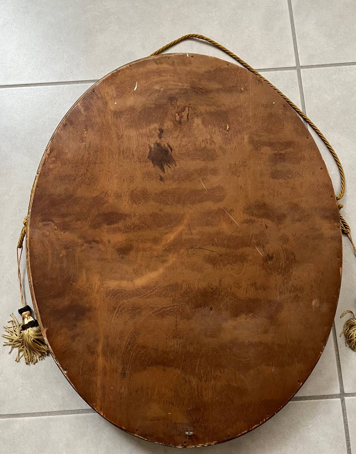 Oval gilt mirror and Art Deco trim