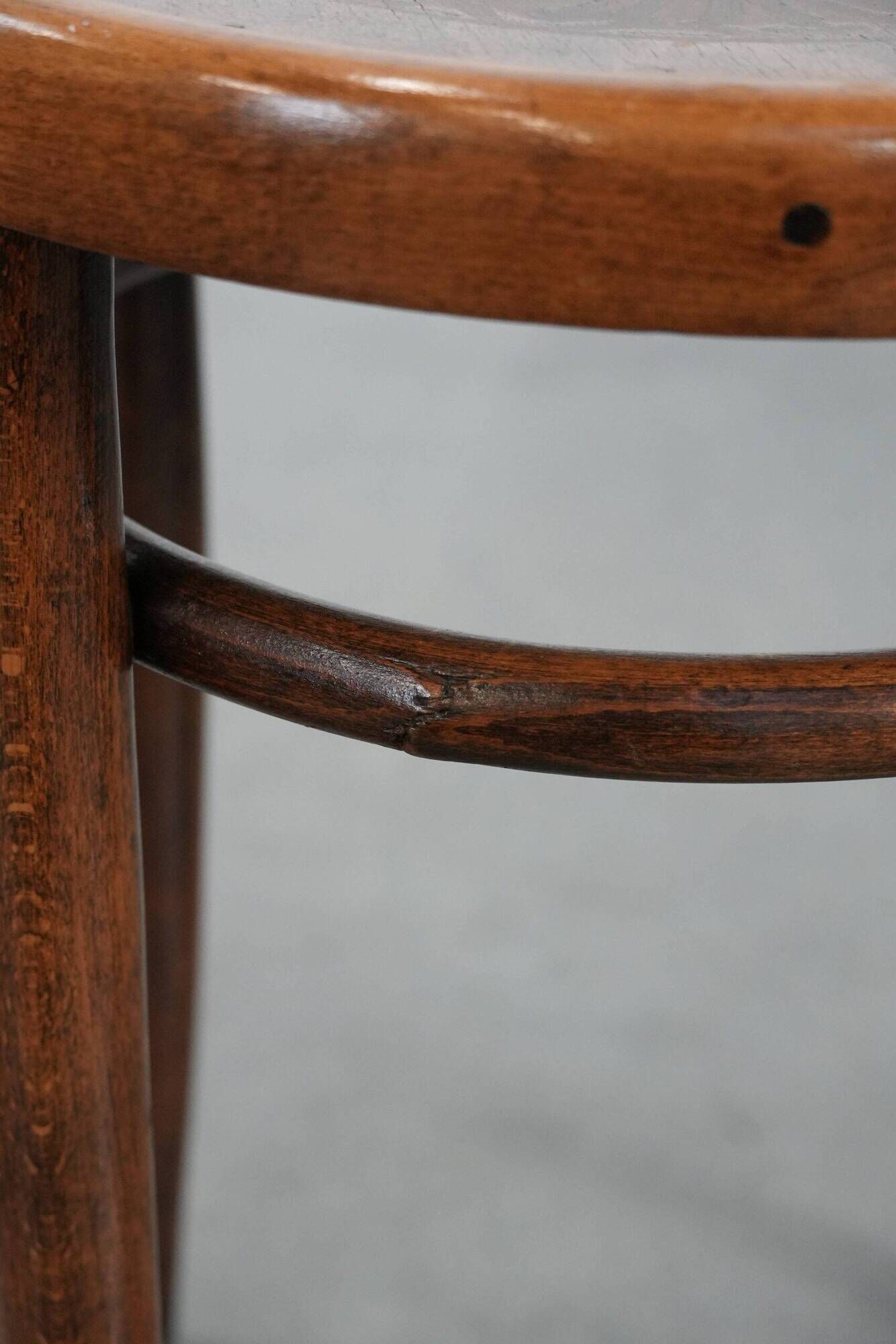 Antique bentwood stool from early 1900s with a seat with beautiful details