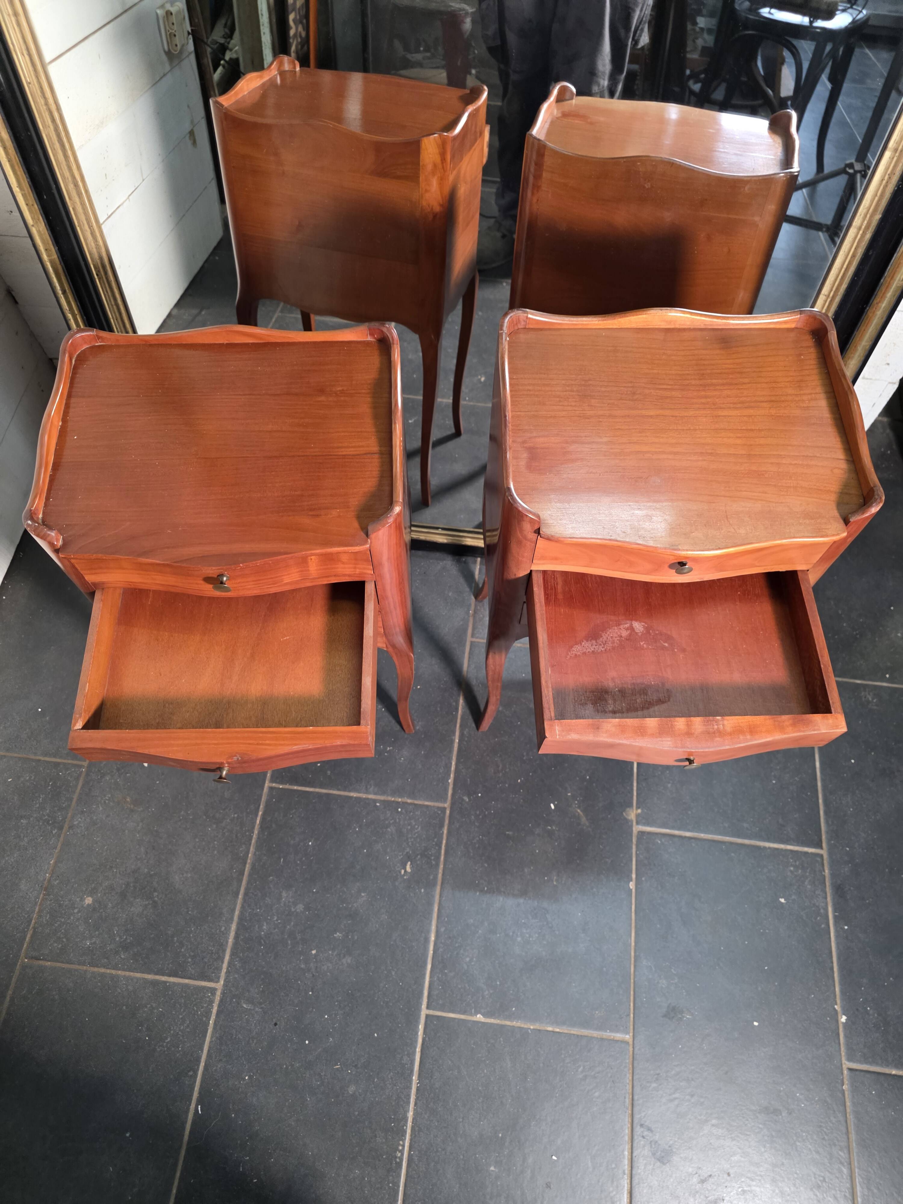 Pair of Louis XV style bedside tables in cherry wood.