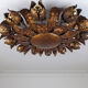 Large mid-century sunburst ceiling lamp, gilded metal with floral motif, 1950s