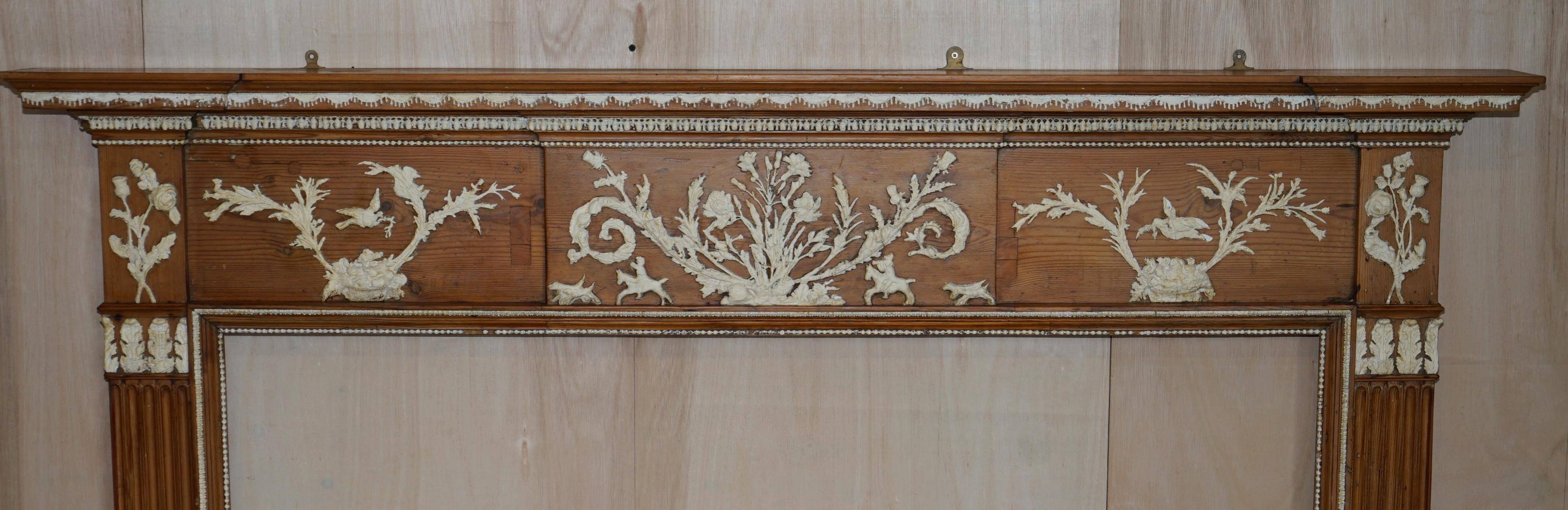 Victorian antique fireplace in tarred pine and sculpted gesso.