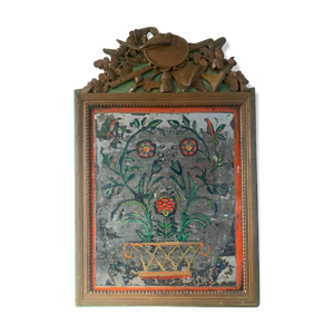 Miroir en bois sculpté et bronziné