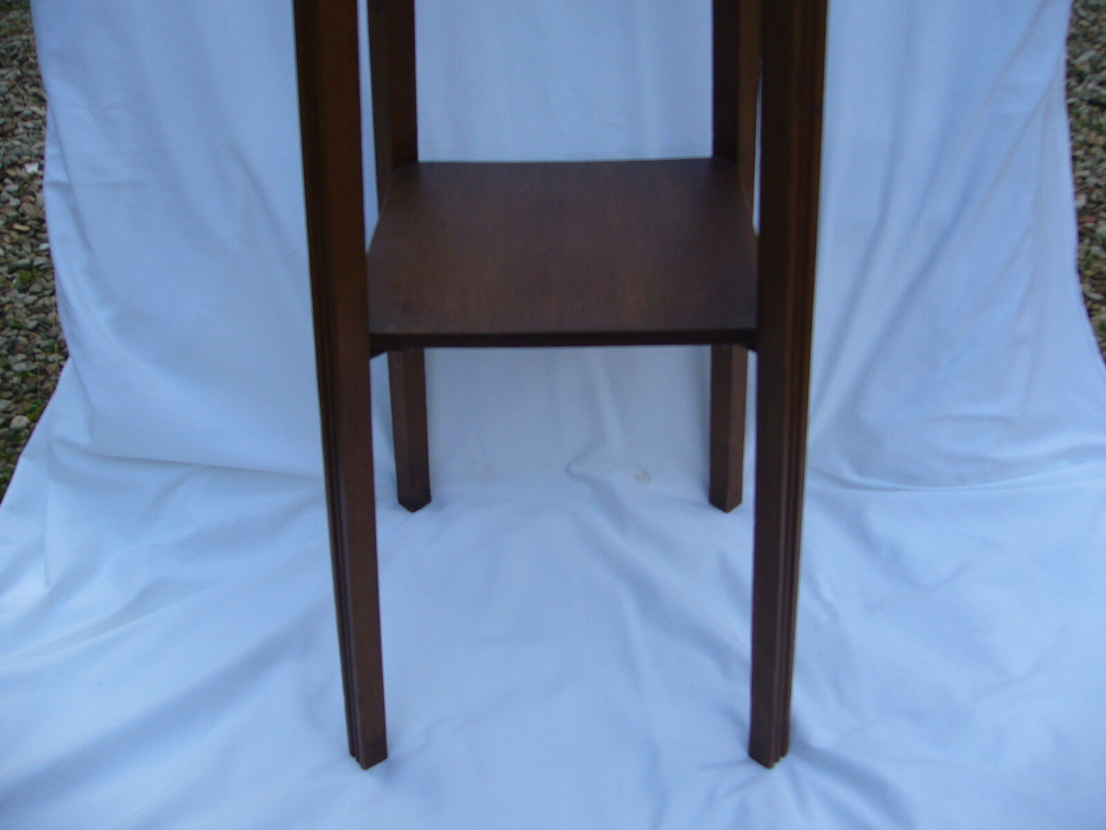 Art deco side table in varnished wood