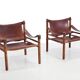 Deux fauteuils Arne Norell Sirocco en palissandre et cuir.