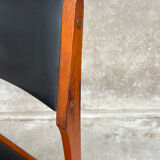 2 wooden and faux leather chairs in Scandinavian style