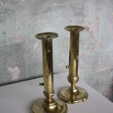 Pair of brass push-up candlesticks