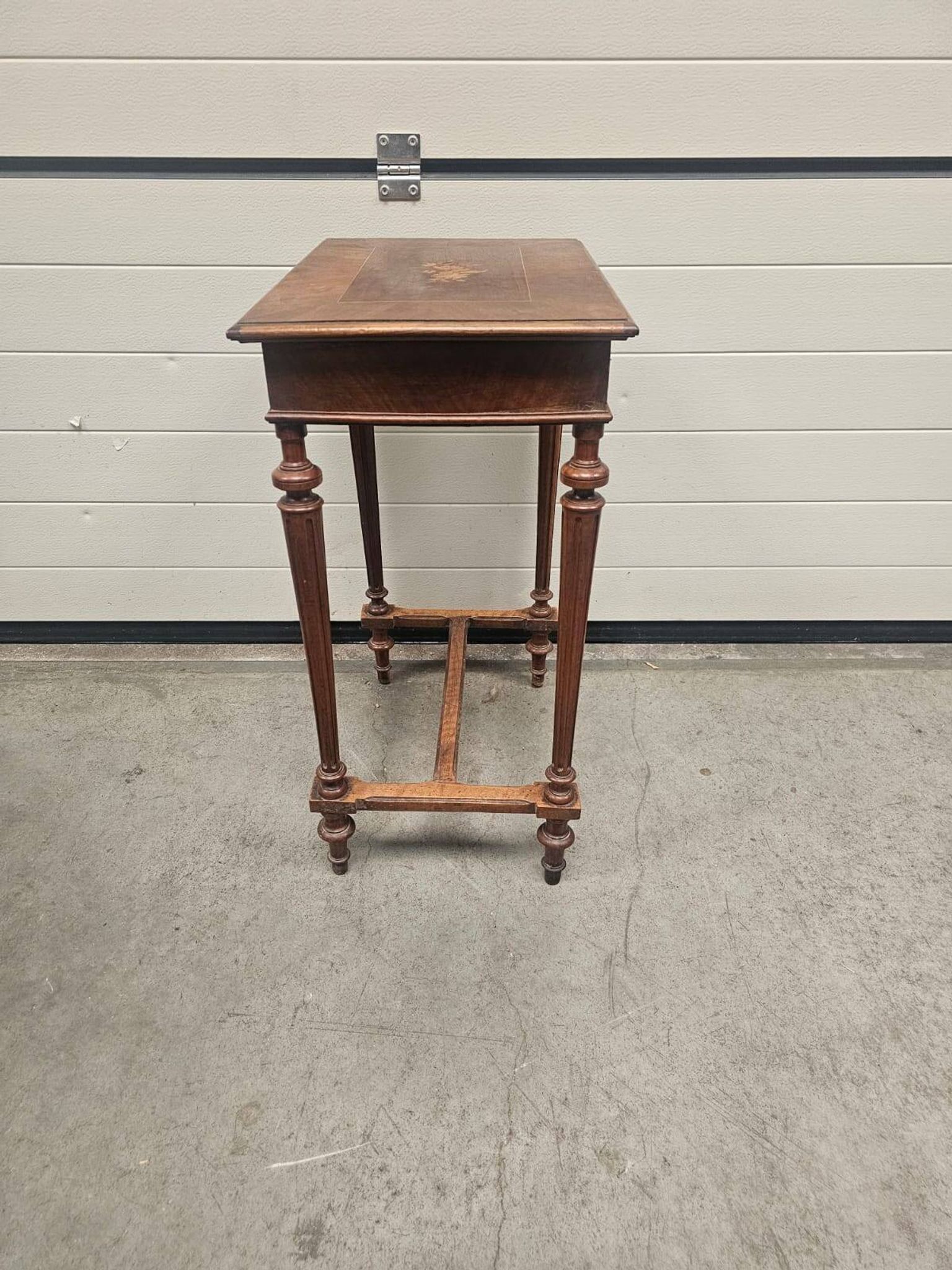 Antique dressing table with floral marquetry and integrated mirror.