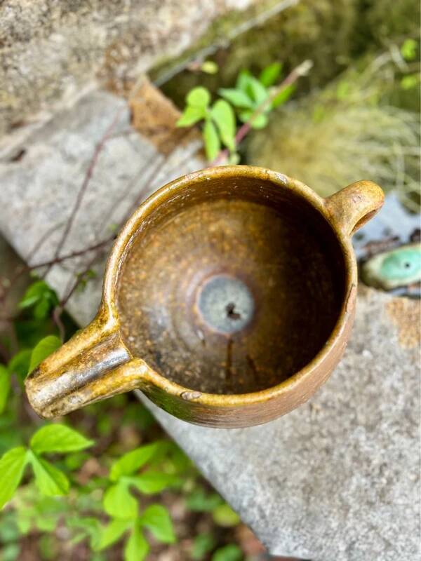 Antique terracotta milk jug