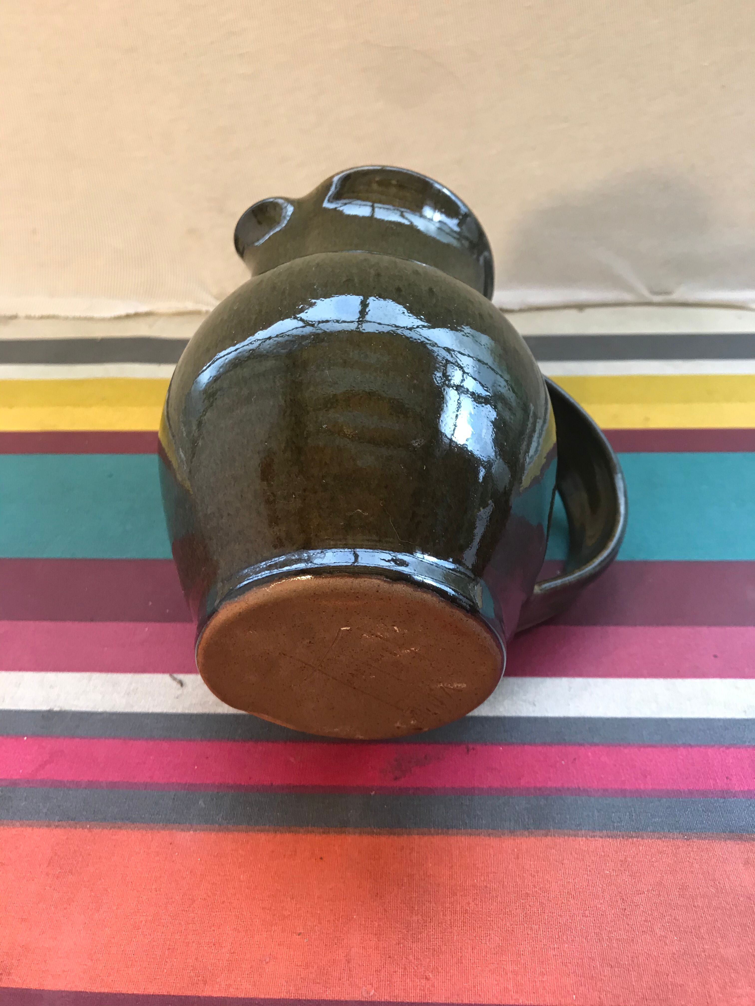 Former green enamelled sandstone pitcher