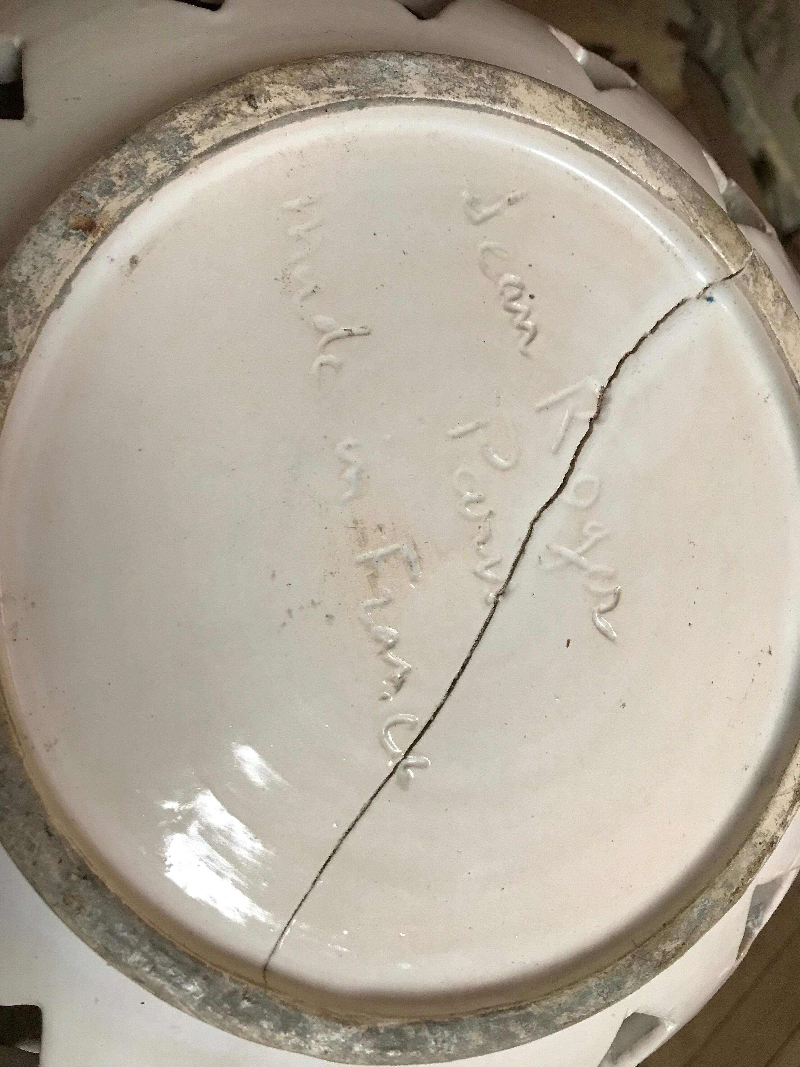 Trompe l'oeil fruit cut in white earthenware by Jean Roger, circa 1960.