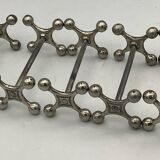 Set of 7 vintage knife rests in the shape of crosses in silver-plated metal.