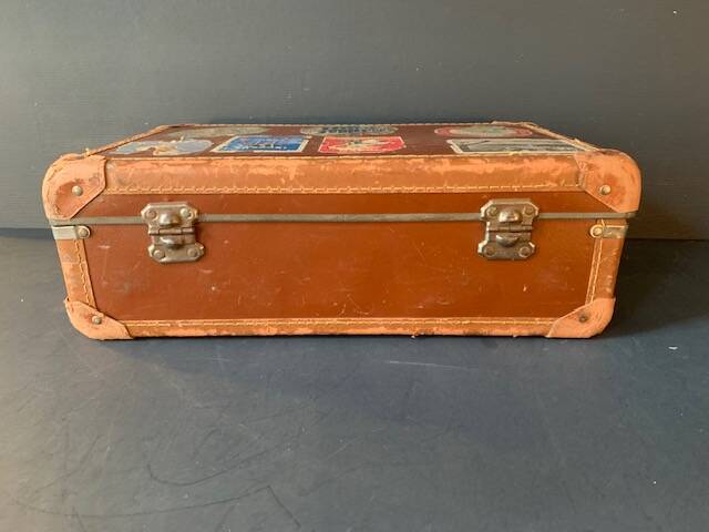 Old travel suitcase and legendary stickers, 1920