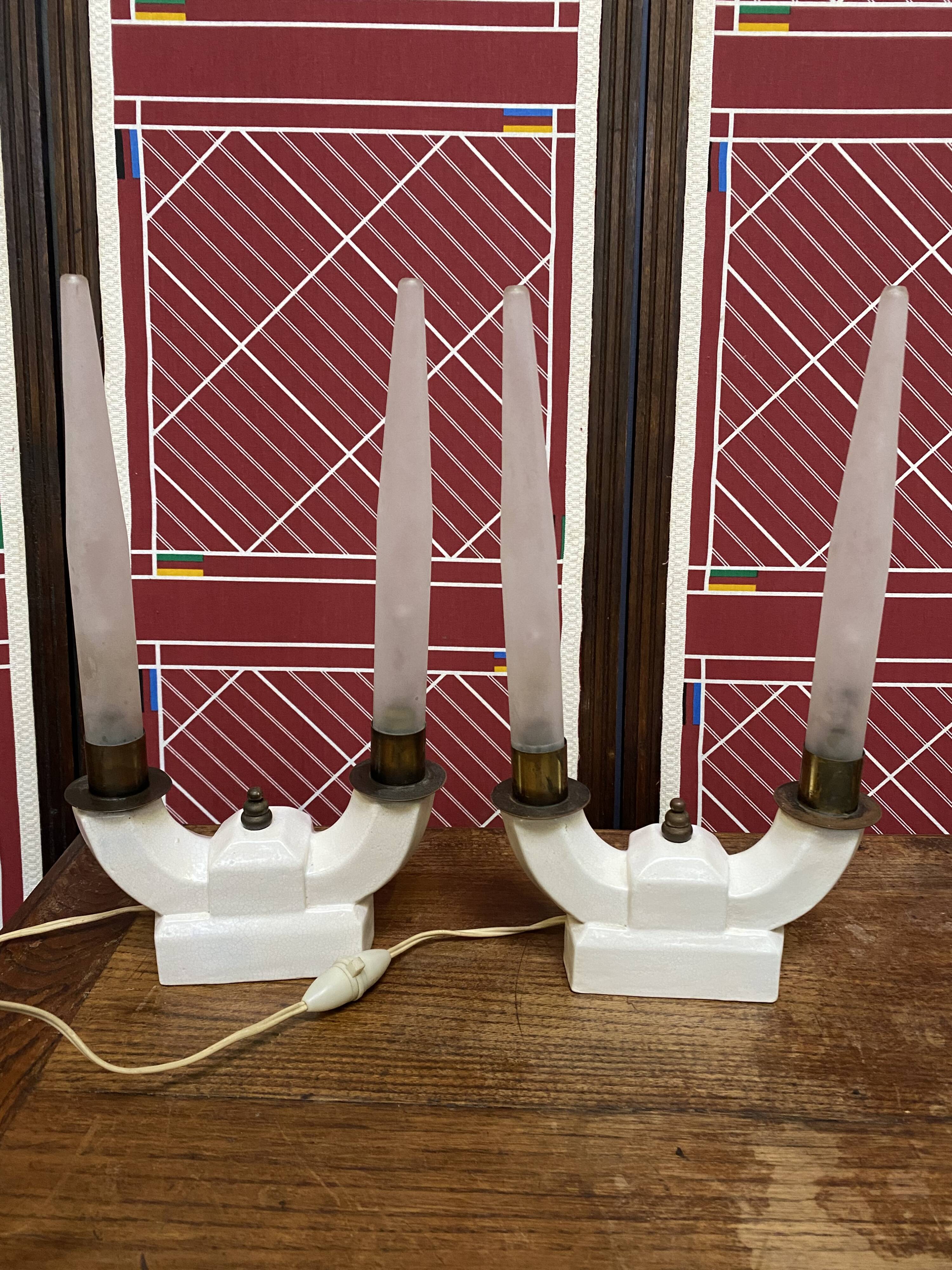 Pair of ceramic and brass office chandeliers