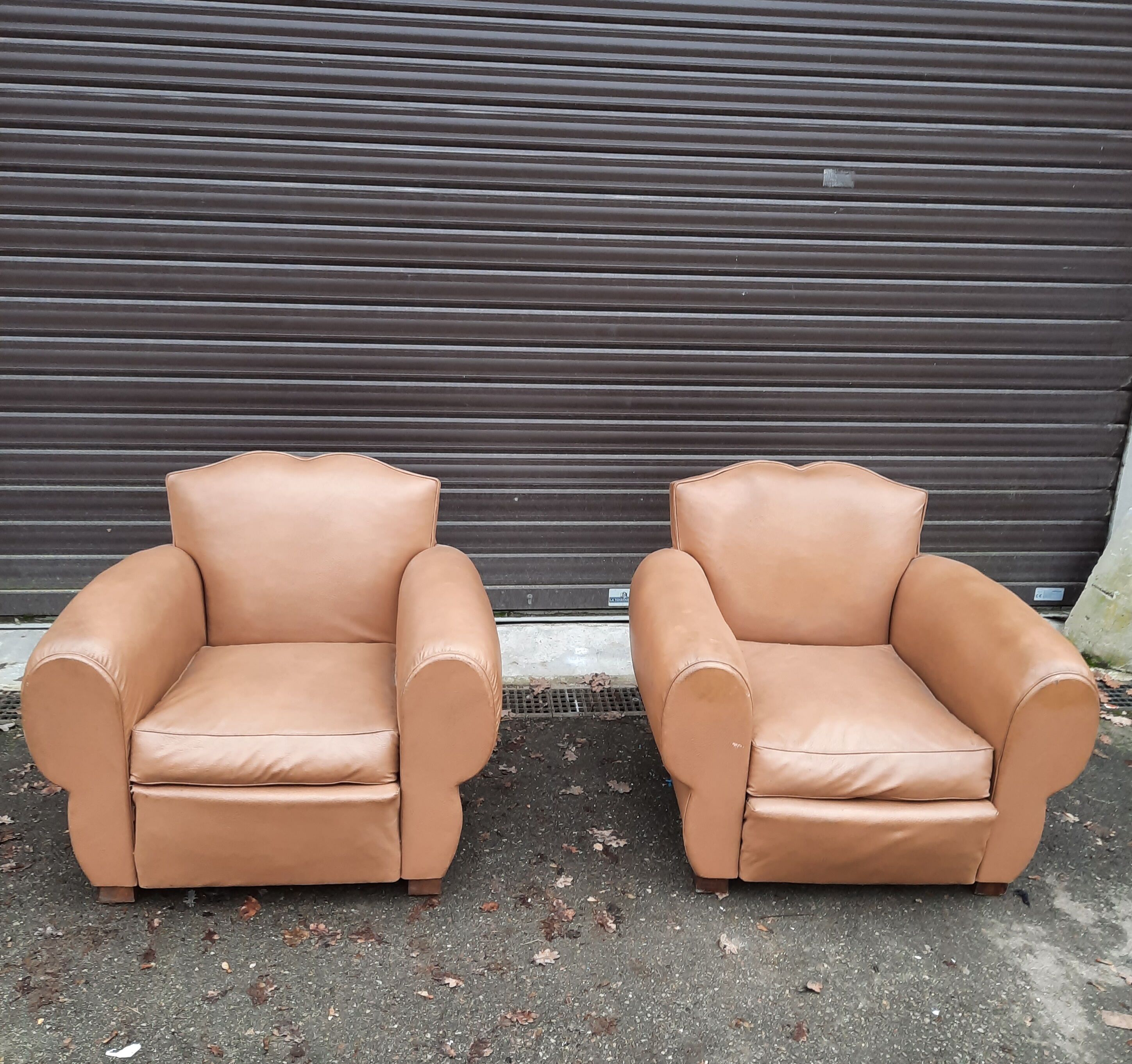 Pair of club chairs in skai