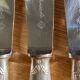12 large Christofle Ribbons silver metal knives